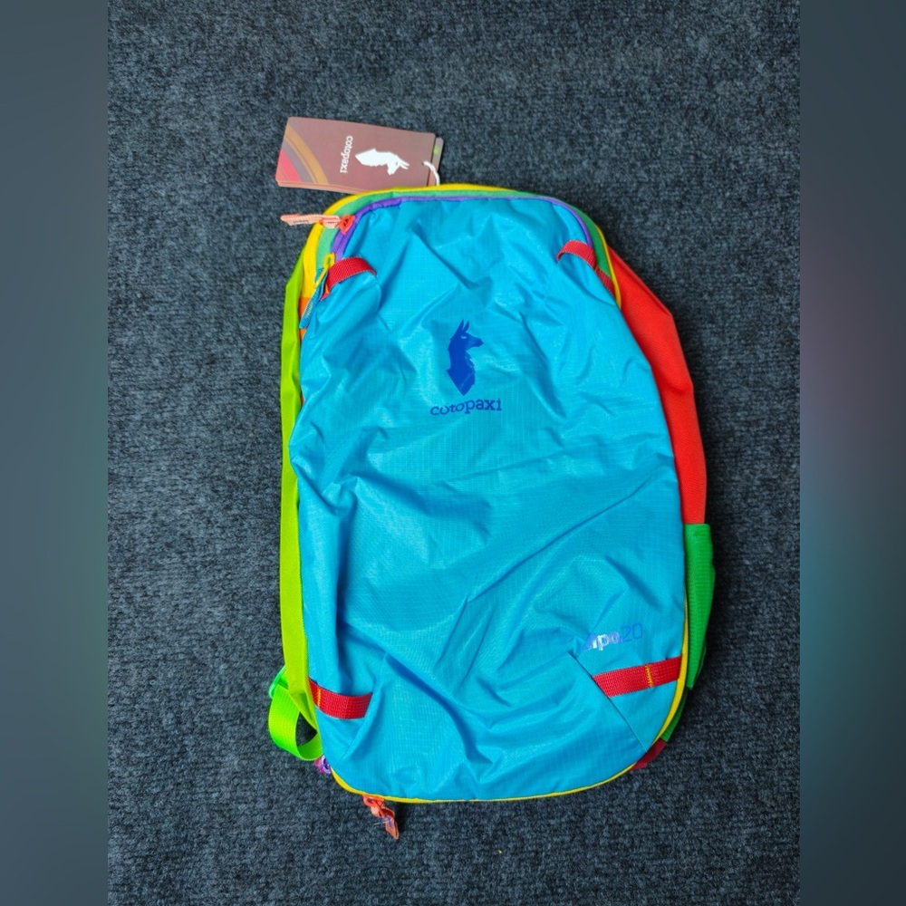 cotopaxi Allpa 20 L bright sky blue daypack with multicolor trim